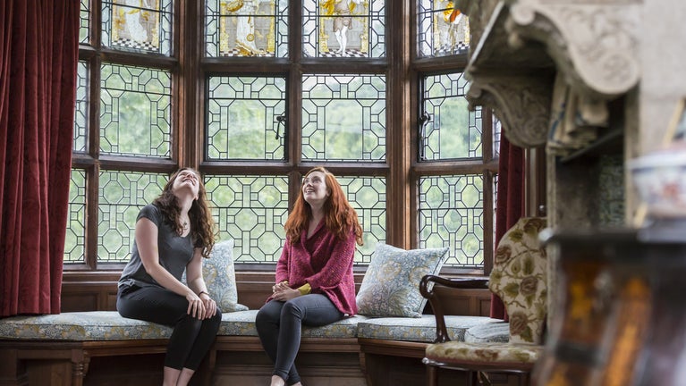 Visitors admiring the interiors at Wightwick Manor and Gardens, Wolverhampton, West Midlands